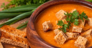 Lentil soup in a wooden dish. (Shuttertstock Photo)
