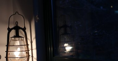 A gaslight lights up a dark room, figuratively representing the opposite of the word's verb form, which refers to manipulating, grossly misleading, downright deceitful behavior. (Shutterstock Photo)