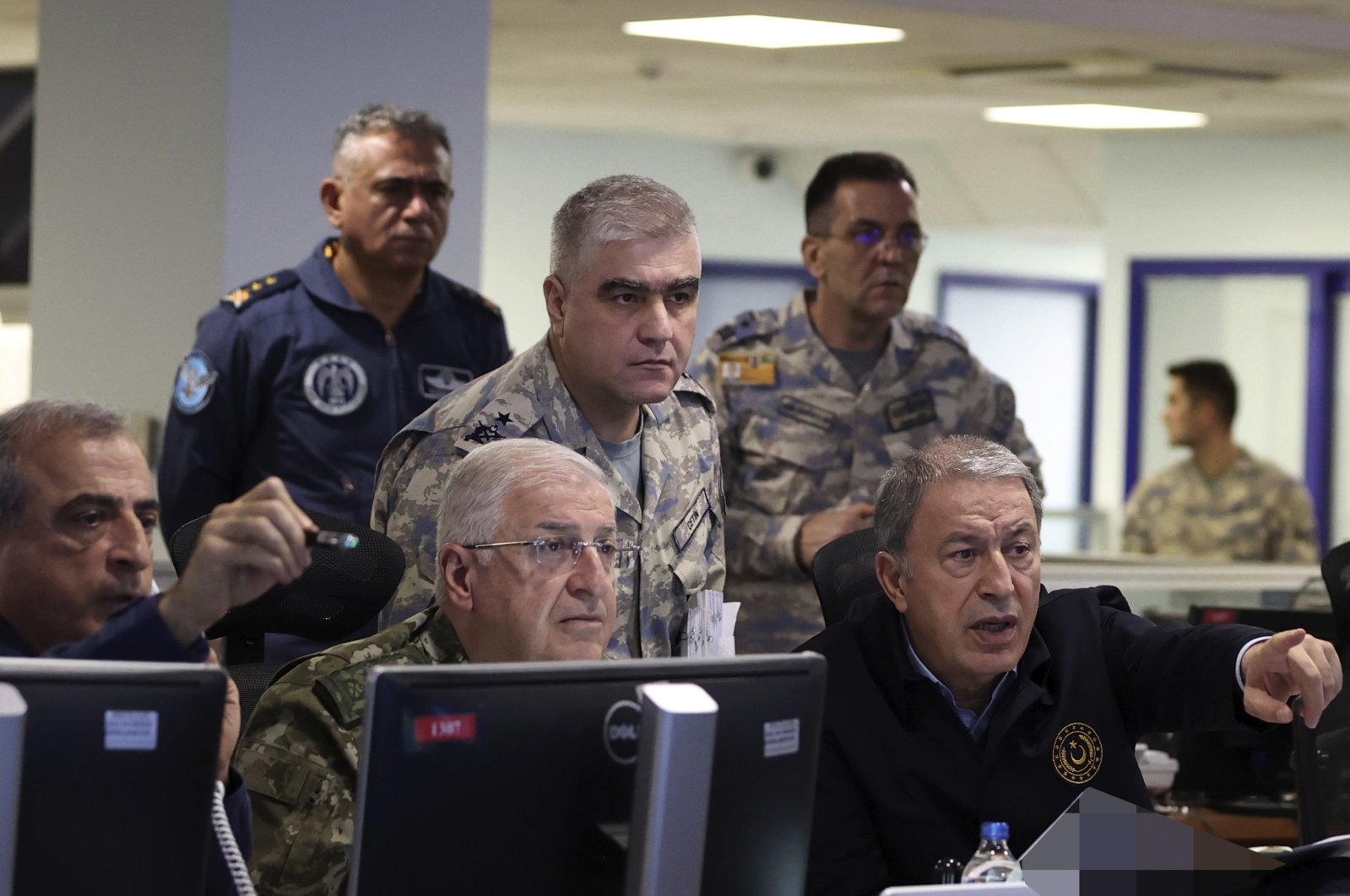 Defense Minister Hulusi Akar (R) and top army commanders work at the Air Force command center, in Ankara, Türkiye, Nov. 20, 2022. (AP Photo)