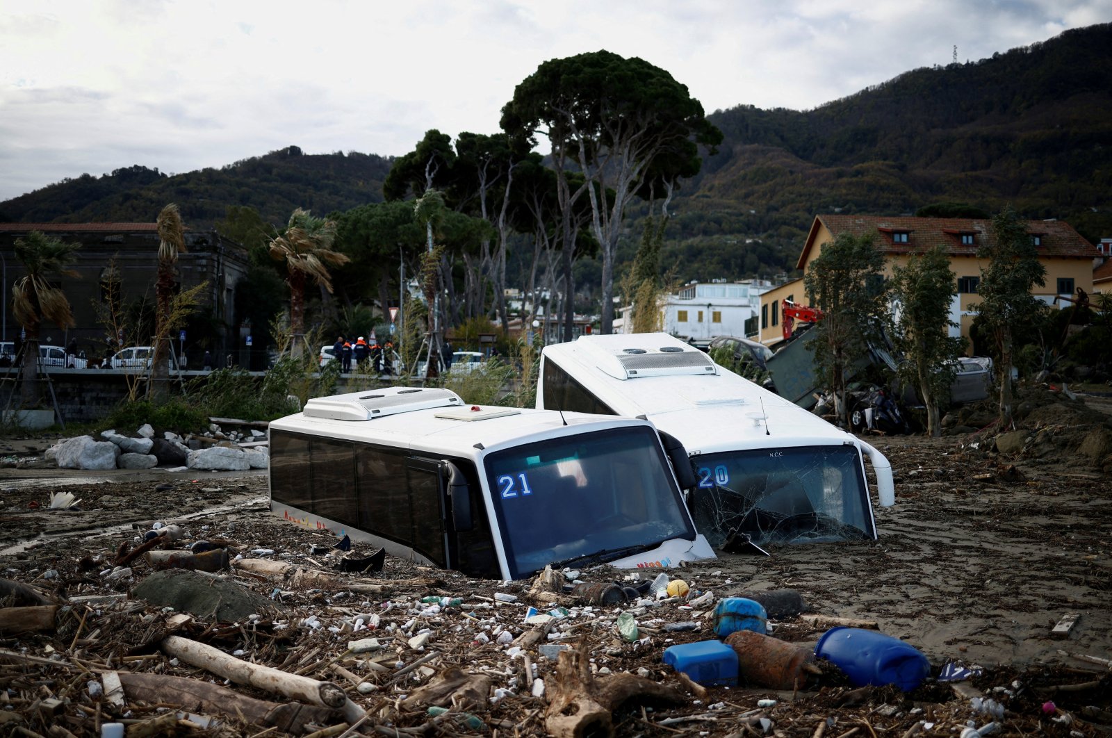 Damaged buses lie among debris following a landslide on the Italian holiday island of Ischia, Italy, Nov. 27, 2022. (Reuters Photo)