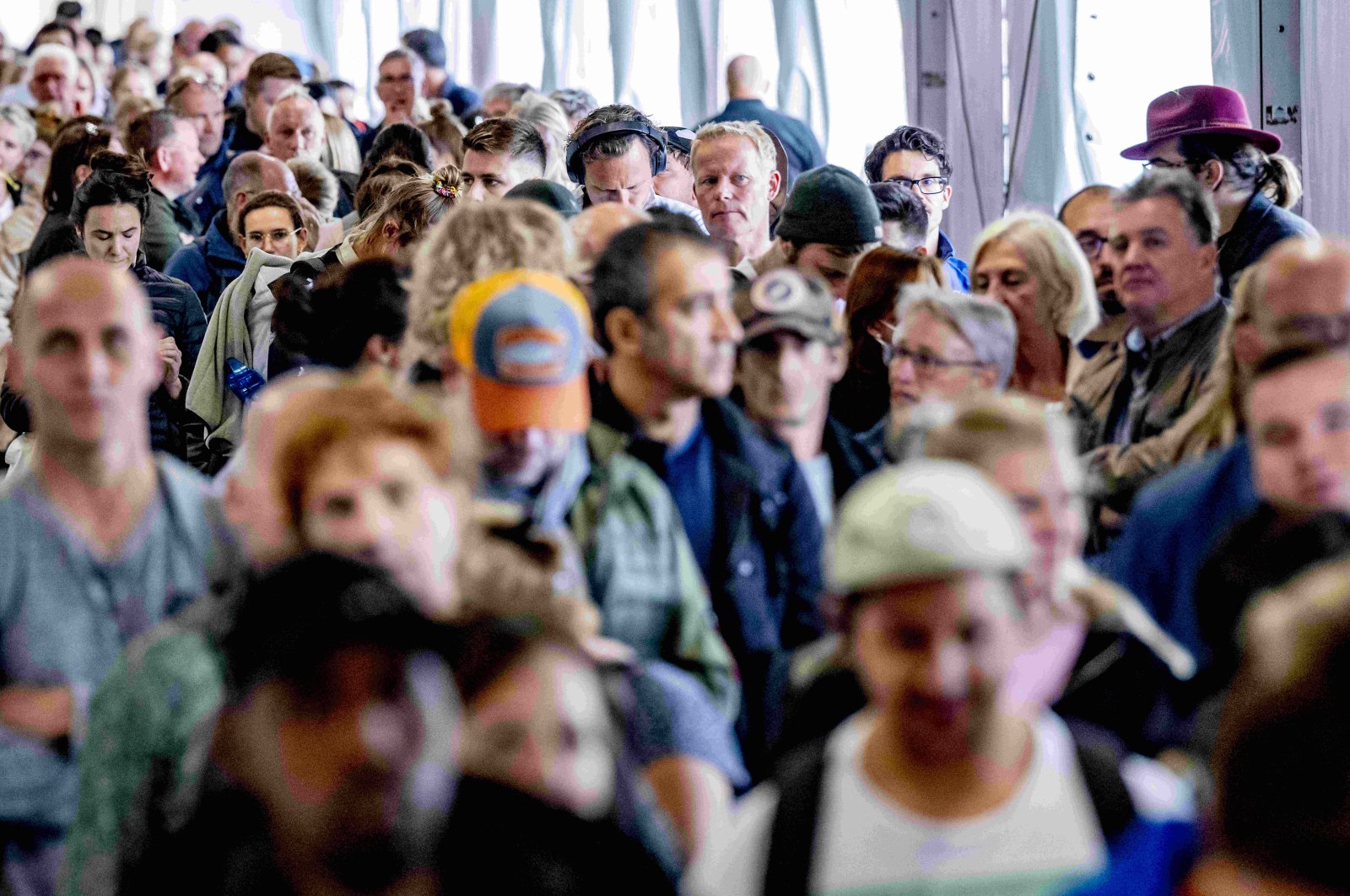Crowds at Schiphol airport, travelers stand in long lines for security, in Amsterdam, Netherlands, on Oct. 3, 2022. (Reuters File Photo)