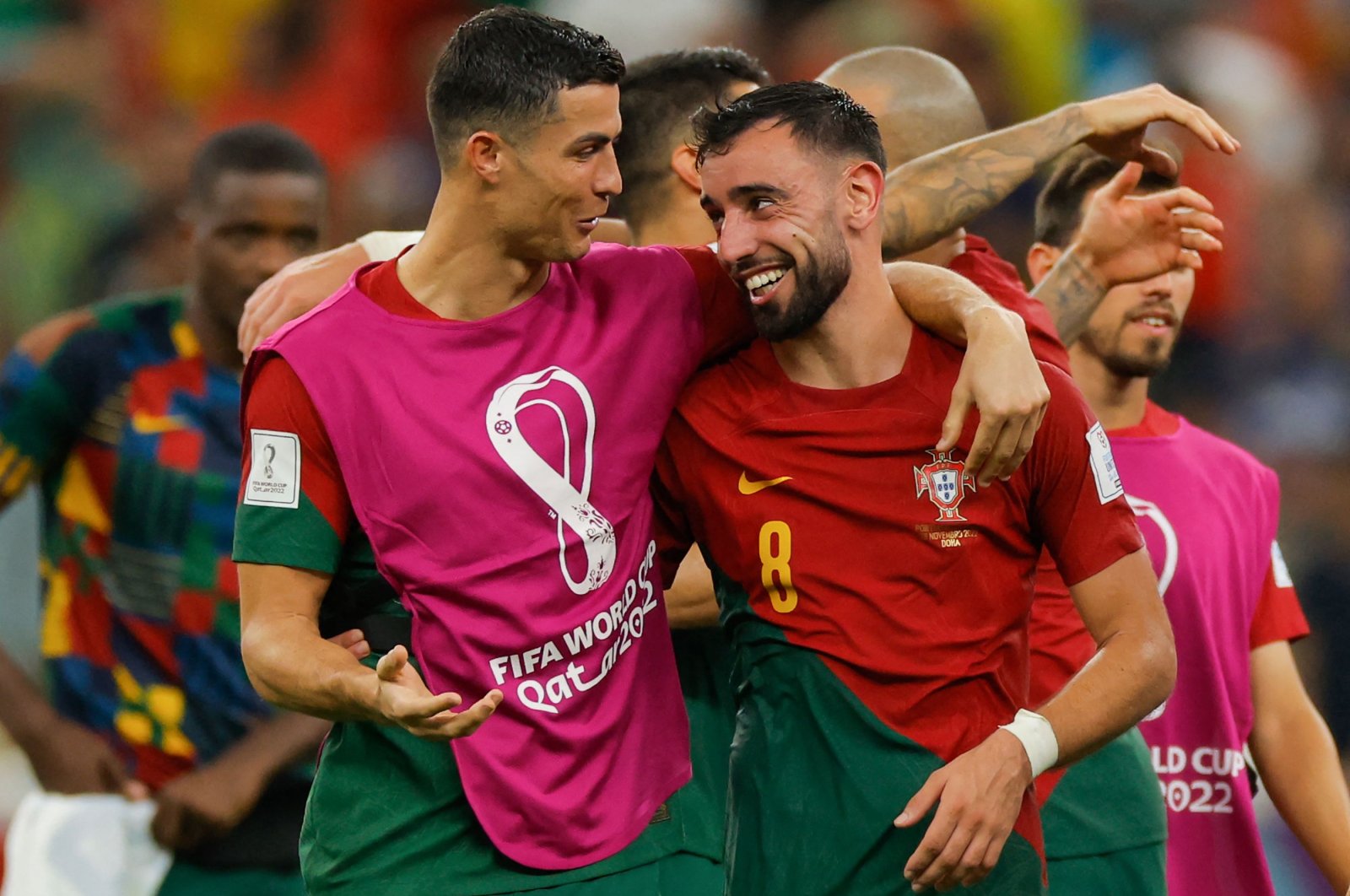 Portugal&#039;s forward #07 Cristiano Ronaldo (L) and Portugal&#039;s midfielder #08 Bruno Fernandes celebrate after they won the Qatar 2022 World Cup Group H football match between Portugal and Uruguay at the Lusail Stadium in Lusail, north of Doha on Nov. 28, 2022. (AFP Photo)