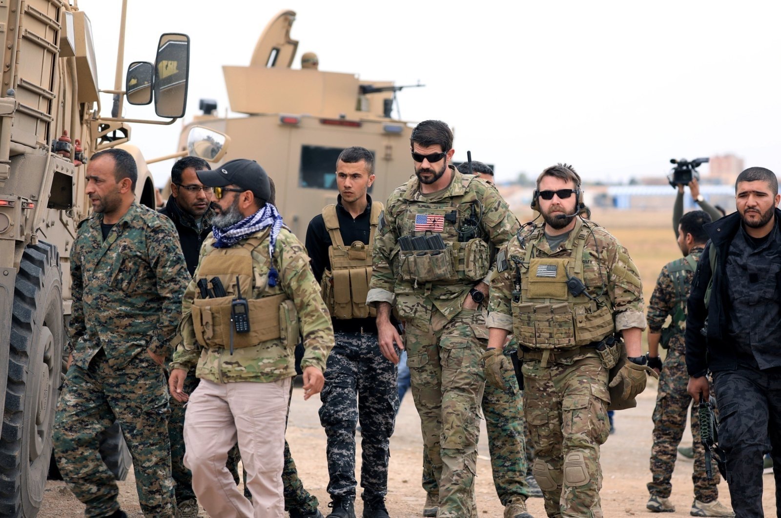 YPG terrorists and U.S. troops are seen together during a joint patrol near the Turkish border in Hassakeh, northeastern Syria, Nov. 4, 2018. (Reuters File Photo)