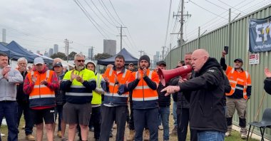 Former union leader Christy Cain rallies workers on strike at Knauf plasterboard plant in Melbourne, Australia, Oct. 5, 2022, in this still image taken from video. (Reuters Photo)