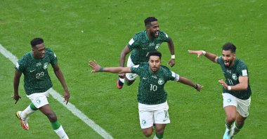 Saudi Arabia's midfielder Salem al-Dawsari celebrates with his teammates after scoring the second goal during the Qatar 2022 World Cup Group C football match between Argentina and Saudi Arabia at the Lusail Stadium, Lusail, Doha, Nov. 22, 2022. (AFP Photo)