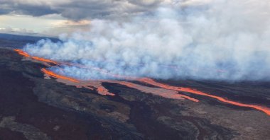 An aerial view shows the Mauna Loa volcano erupting from vents on the Northeast Rift Zone on the Big Island of Hawaii, U.S., Nov. 28, 2022. (AP Photo)