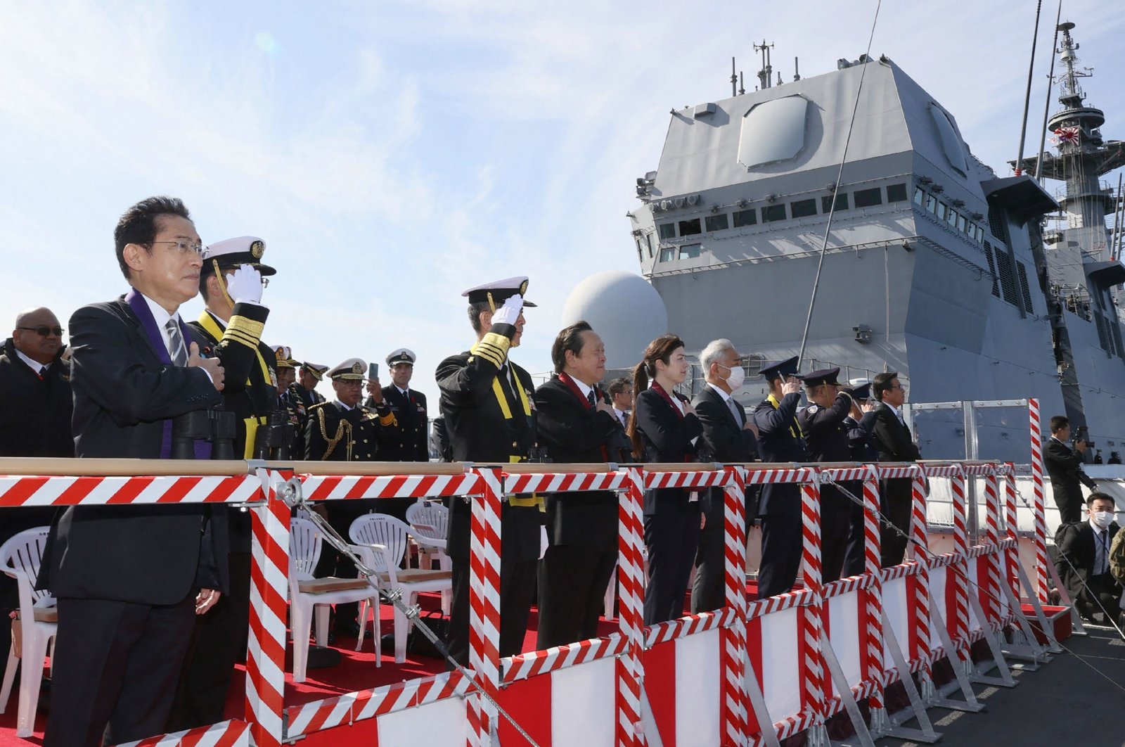 Japanese Prime Minister Fumio Kishida (far L) looks out from the Japanese ship JS Izumo as he inspects the &quot;International Fleet Review,&quot; held by Japan&#039;s Maritime Self-Defense Force with 12 other countries, Sagami Bay, Japan, Nov. 6, 2022. (AFP Photo)