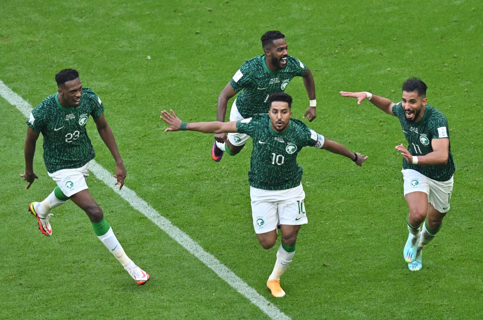Saudi Arabia&#039;s midfielder Salem al-Dawsari celebrates with his teammates after scoring the second goal during the Qatar 2022 World Cup Group C football match between Argentina and Saudi Arabia at the Lusail Stadium, Lusail, Doha, Nov. 22, 2022. (AFP Photo)