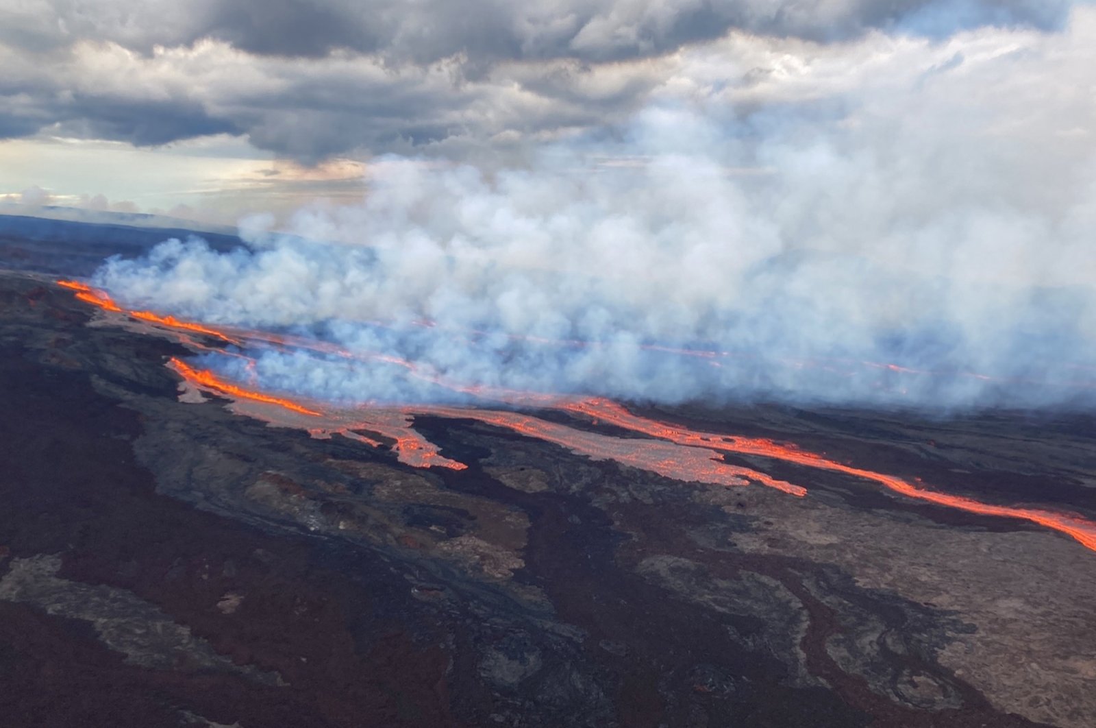 An aerial view shows the Mauna Loa volcano erupting from vents on the Northeast Rift Zone on the Big Island of Hawaii, U.S., Nov. 28, 2022. (AP Photo)