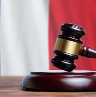 Judge hammer on a French flag background in this undated file photo. (Shutterstock File Photo)