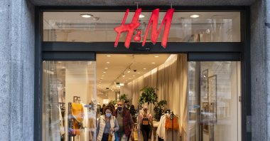 Shoppers are seen at the Swedish multinational clothing design retail company Hennes & Mauritz, H&M, store in Spain, May 4, 2022. (Reuters Photo)