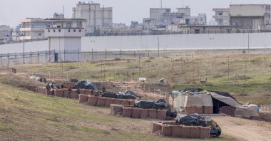 Turkish army vehicles are positioned at a military post as the Syrian border town of Jarablus is seen behind the Turkish-Syrian border line in Karkamış in Gaziantep province, Türkiye, Nov. 29, 2022. (REUTERS Photo)