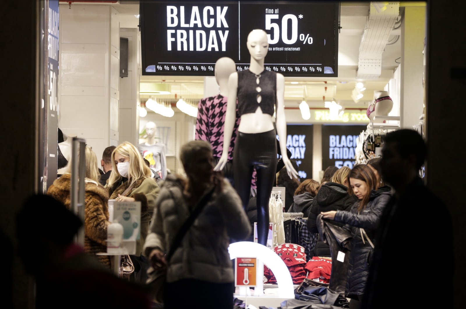 People shop during Black Friday sales in Via del Corso in Rome, Italy, Nov. 25, 2022. (AP Photo)