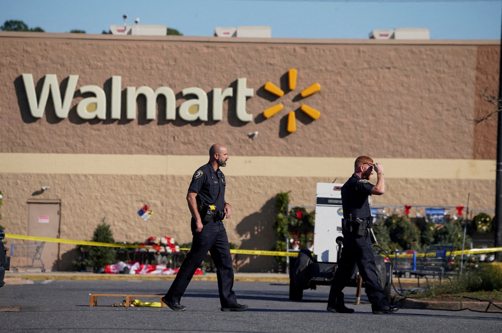 Police walk through the parking lot after a mass shooting at a Walmart in Chesapeake, Virginia, U.S., Nov. 23, 2022. (Reuters Photo)
