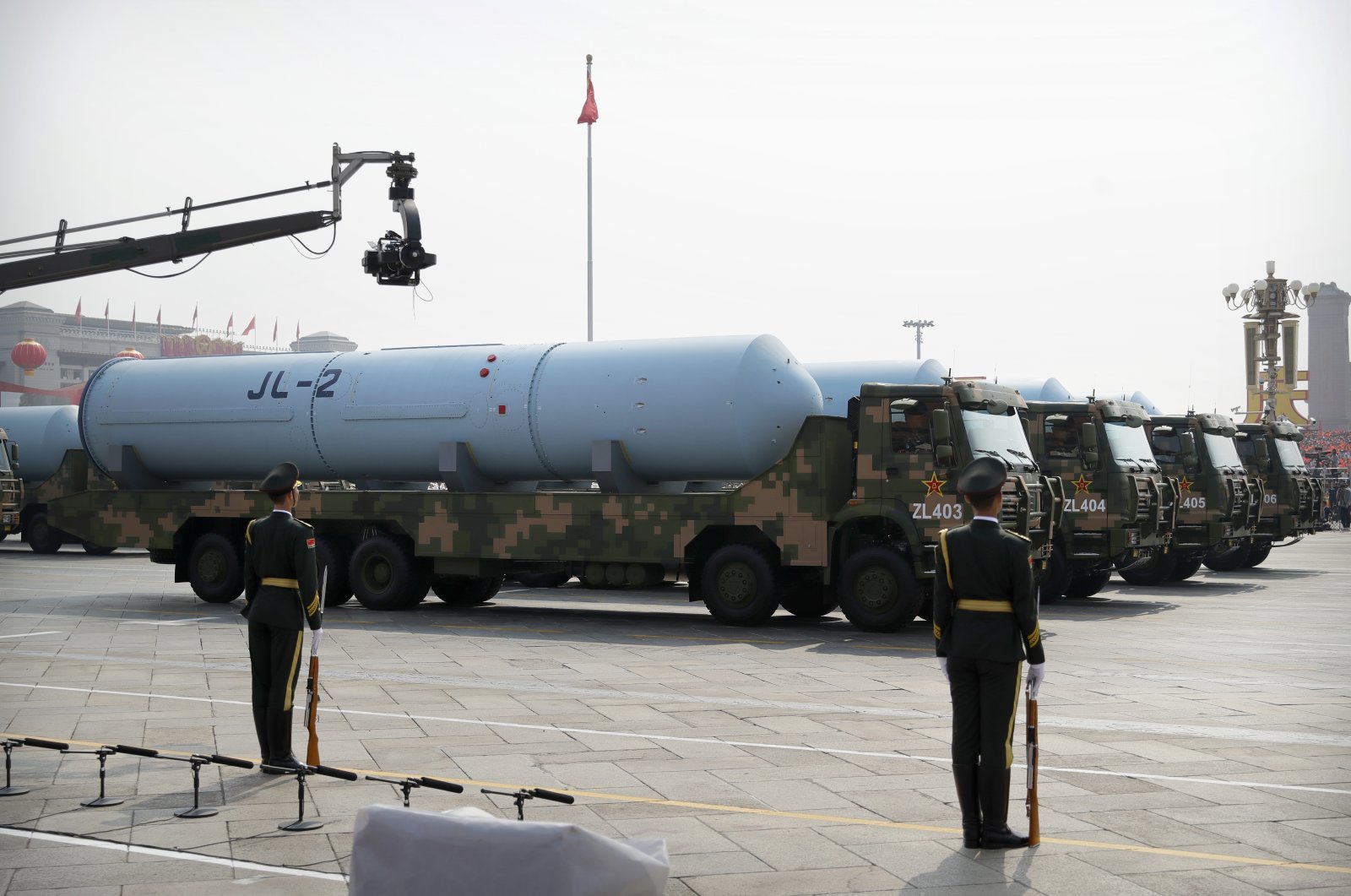Military vehicles carrying JL-2 submarine-launched missiles roll during a parade, Beijing, China, Oct. 1, 2019. (AP Photo)