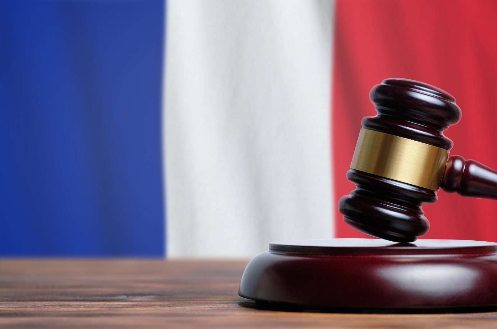 Judge hammer on a French flag background in this undated file photo. (Shutterstock File Photo)