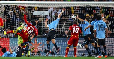 Uruguay&#039;s Luis Suarez handles the ball on the goal line, for which he is sent off, during the 2010 FIFA World Cup South Africa quarterfinal match between Uruguay and Ghana at the Soccer City stadium, Johannesburg, South Africa, July 2, 2010. (Getty Images Photo)