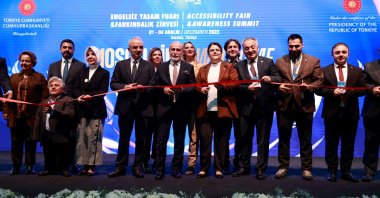 Minister of Family and Social Services Derya Yanık (C) cuts the ribbon at the opening ceremony of the Accessibility Fair, in Istanbul, Türkiye, Dec. 1, 2022. (AA Photo)