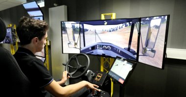 A student uses a driving simulator for civil engineering machines, in Egletons, France, Oct. 4, 2017. (Reuters Photo)