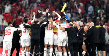 Morocco players and staff members celebrate after they won the Qatar 2022 World Cup Group F football match between Canada and Morocco at the Al-Thumama Stadium to advance to the round of 16, in Doha, Qatar, Dec. 1, 2022. (AFP Photo)