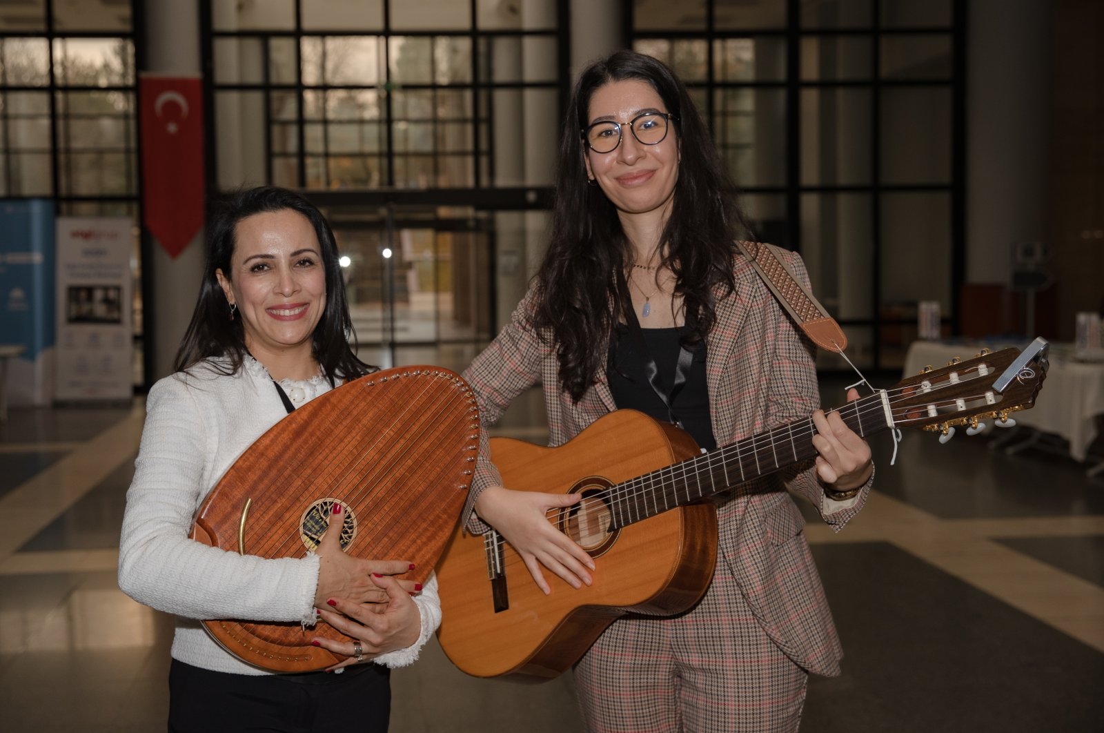 Burçin Uçaner Çifdalöz (R), a faculty member at Ankara Hacı Bayram Veli University Musicology Department and head of the Music Therapy Association, and Yeşim Saltık (L), a music therapist who came to Turkey from the Netherlands to work on the project. (AA Photo)