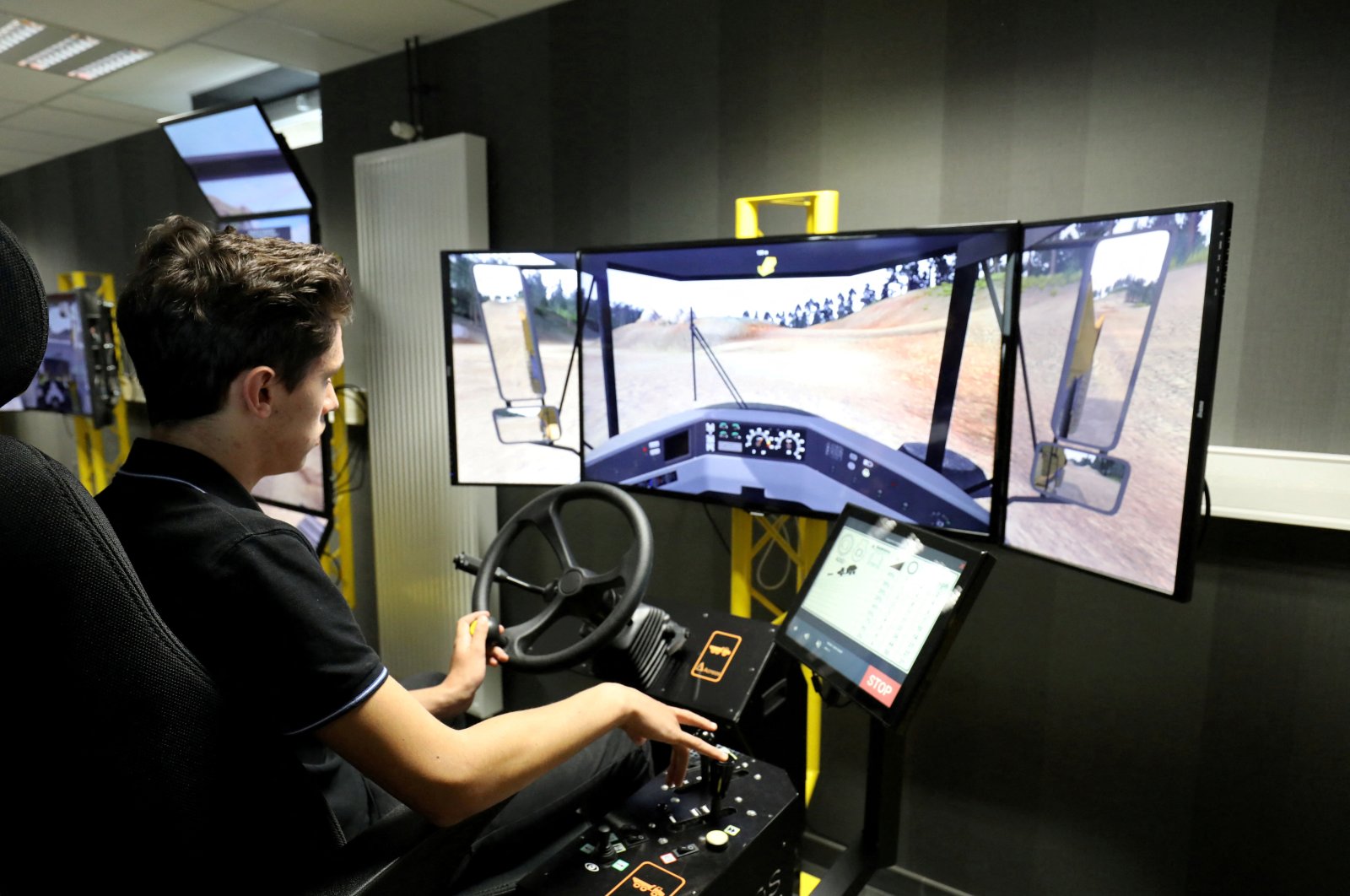 A student uses a driving simulator for civil engineering machines, in Egletons, France, Oct. 4, 2017. (Reuters Photo)