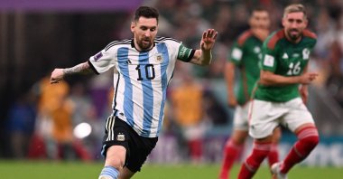 Argentina's forward Lionel Messi runs with the ball during the Qatar 2022 World Cup Group C football match between Argentina and Mexico at the Lusail Stadium, Lusail, Doha, Nov. 26, 2022. (AFP Photo)