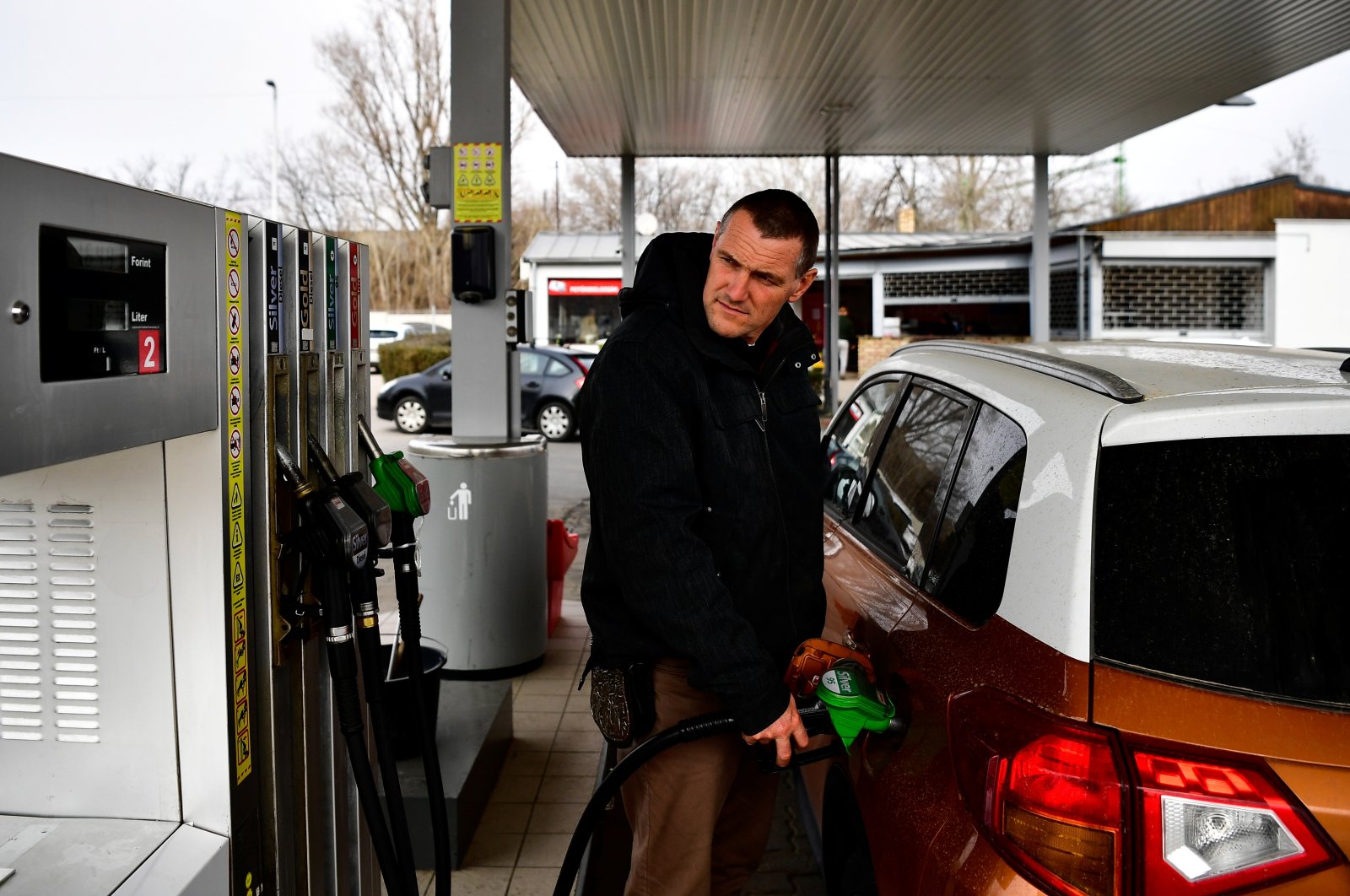 A driver fills a car at a gas station in Martonvasar, Hungary, March 18, 2022. (Reuters Photo)