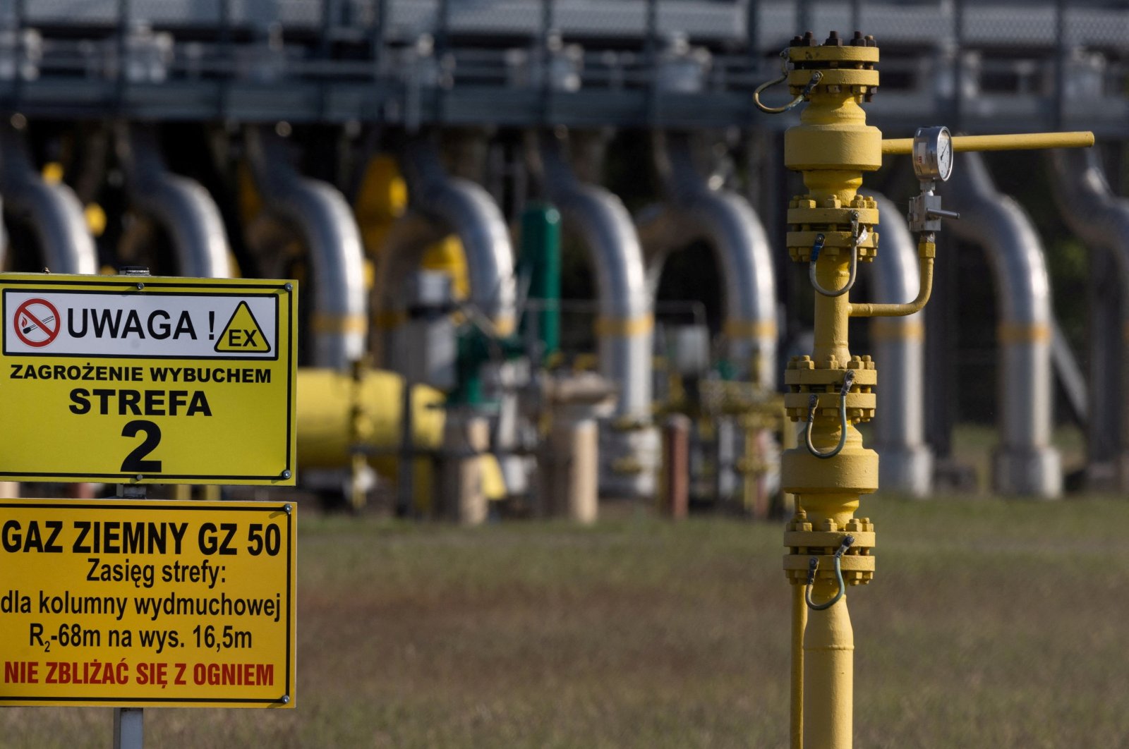 Warning signs are pictured in front of the gas compressor station, a part of the Polish section of the Yamal pipeline that links Russia with Western Europe, in Gabinek near Wloclawek, Poland, May 23, 2022. (Reuters Photo)