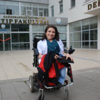 Dr. Sare Aydın poses for a photo outside her university after finishing her residency to become a specialist in her field, Tokat, northern Türkiye, Dec. 3, 2022. (IHA Photo)