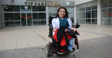 Dr. Sare Aydın poses for a photo outside her university after finishing her residency to become a specialist in her field, Tokat, northern Türkiye, Dec. 3, 2022. (IHA Photo)