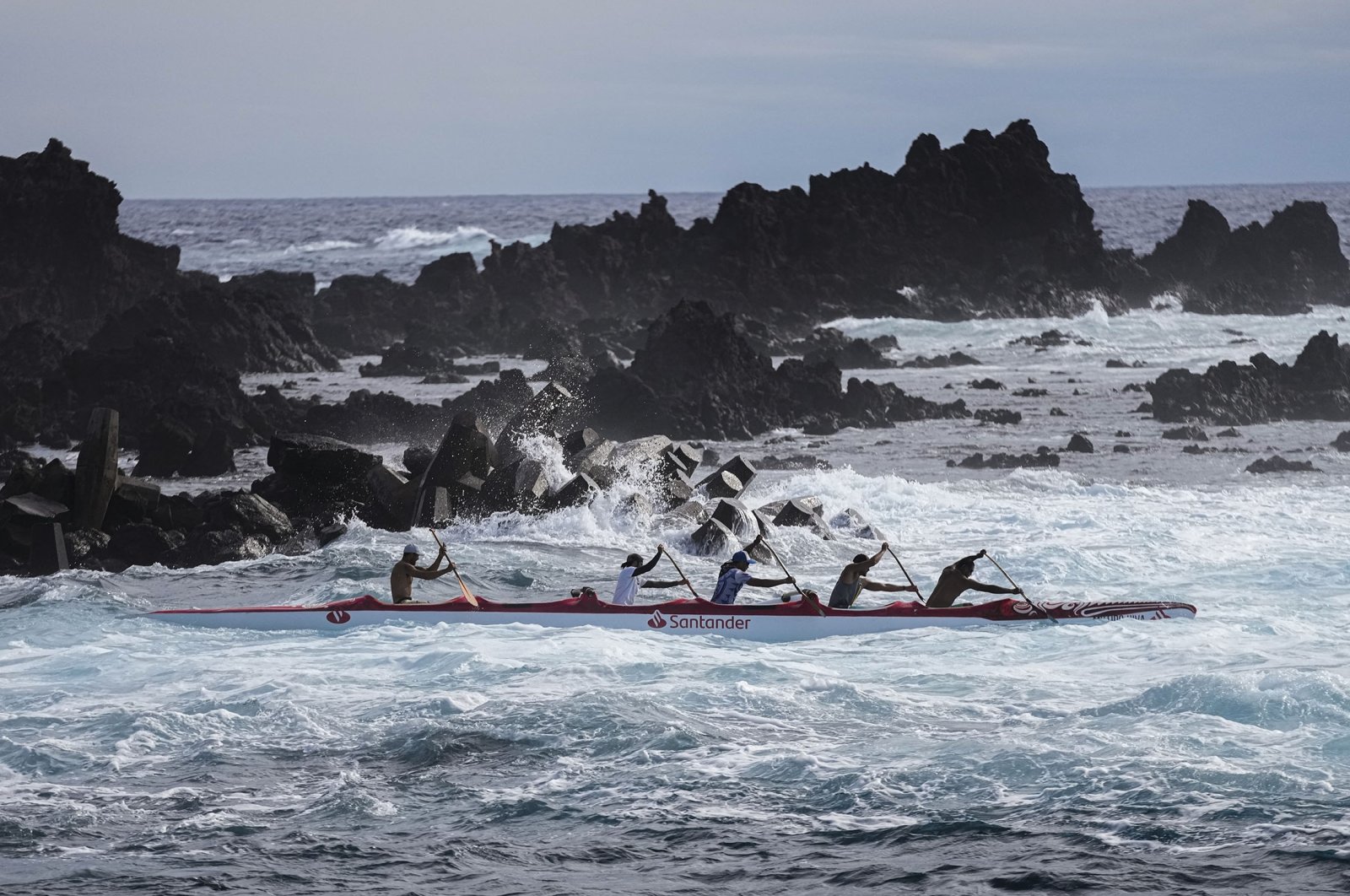 Crew members train for the Hoki Mai Challenge, a voyage that covers almost 500 kilometers, or about 300 miles across a stretch of the Pacific Ocean, in Rapa Nui, a territory that is part of Chile and is better known as Easter Island, Nov. 24, 2022. (AP Photo)