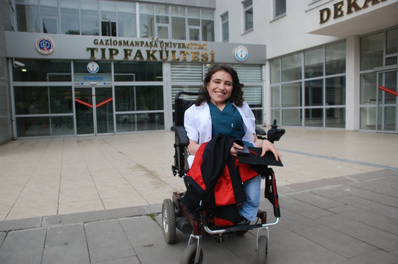 Dr. Sare Aydın poses for a photo outside her university after finishing her residency to become a specialist in her field, Tokat, northern Türkiye, Dec. 3, 2022. (IHA Photo)