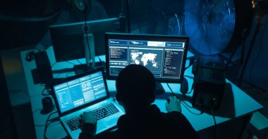 A programmer works on a computer in this undated file photo. (Shutterstock File Photo)