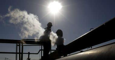 In this Feb. 26, 2011 file photo, a Libyan oil worker, works at a refinery inside the Brega oil complex, in Brega, eastern Libya. (AP File Photo)