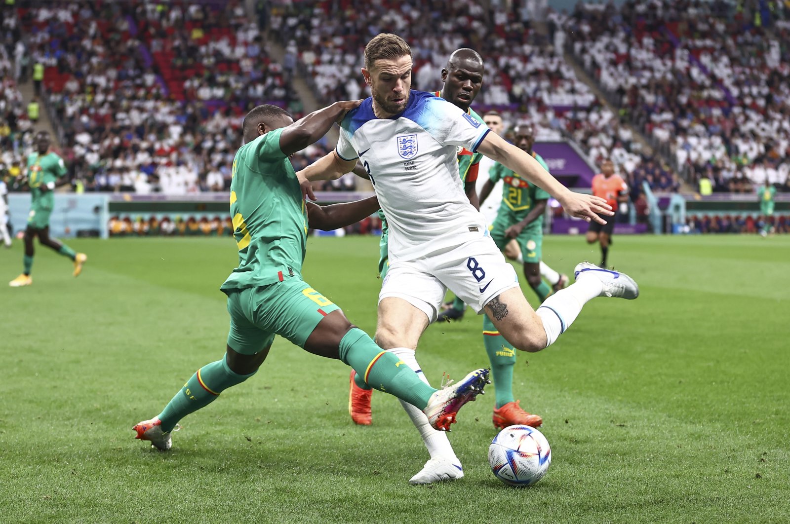 England&#039;s Jordan Henderson in action with Senegal&#039;s Nampalys Mendy during the World Cup round of 16 match at Al Bayt Stadium, Doha, Qatar, Dec. 4, 2022. (AA Photo)