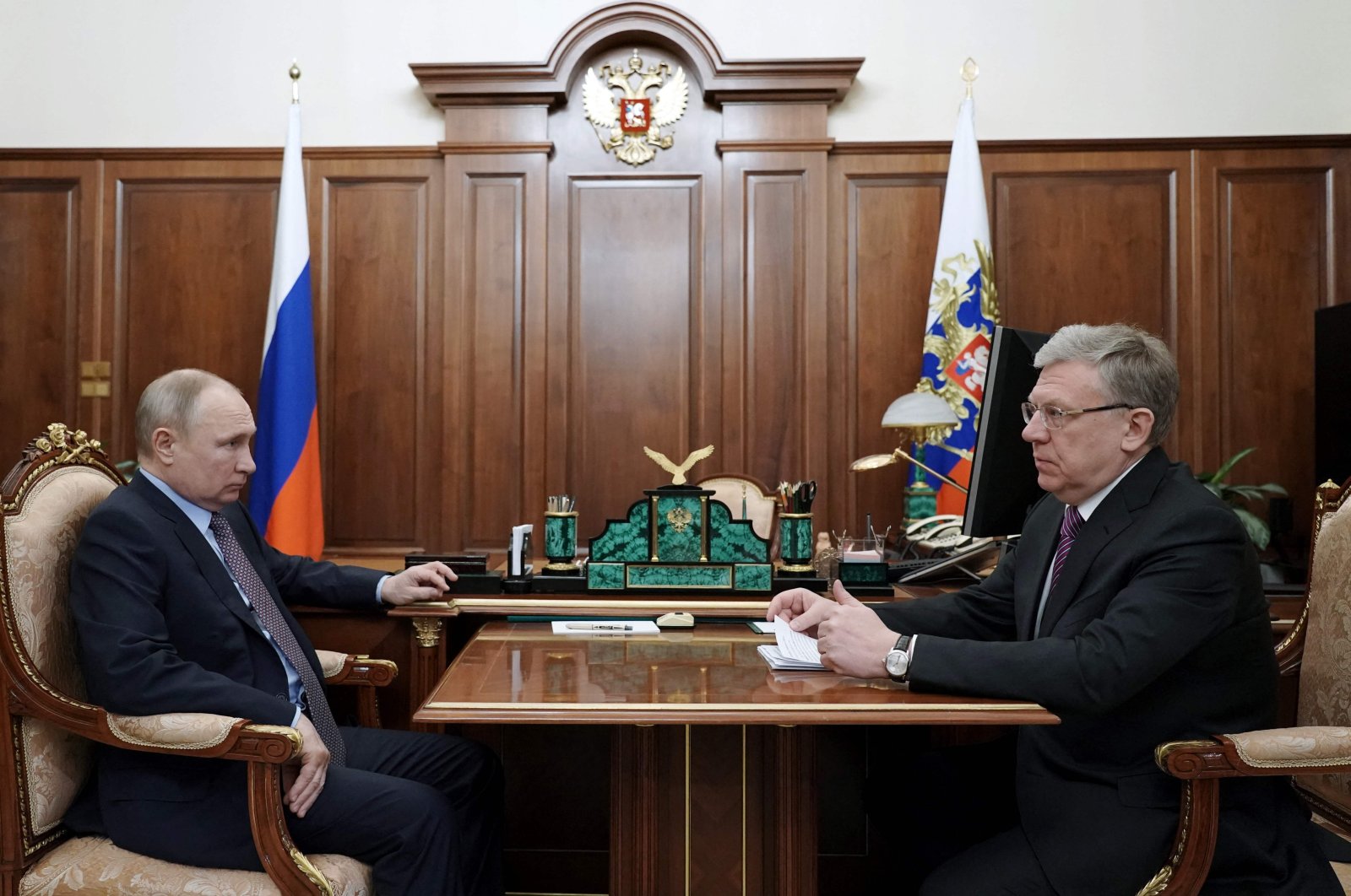 This file photo shows Russian President Vladimir Putin (L) during the meeting with then Audit Chamber head Alexei Kudrin (R) at the Kremlin in Moscow, Russia, March 23, 2021. (AFP Photo)