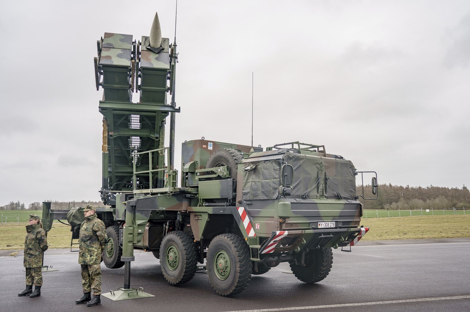 Ready-for-combat Patriot anti-aircraft missile systems of the German forces Bundeswehr stand on the airfield of a military airport in Schwesing, Germany, March 17, 2022. (AP Photo)