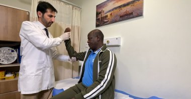 A doctor examines Ousman Tabit Abdoulaye, in Istanbul, Türkiye, Dec. 5, 2022. (AA Photo) 