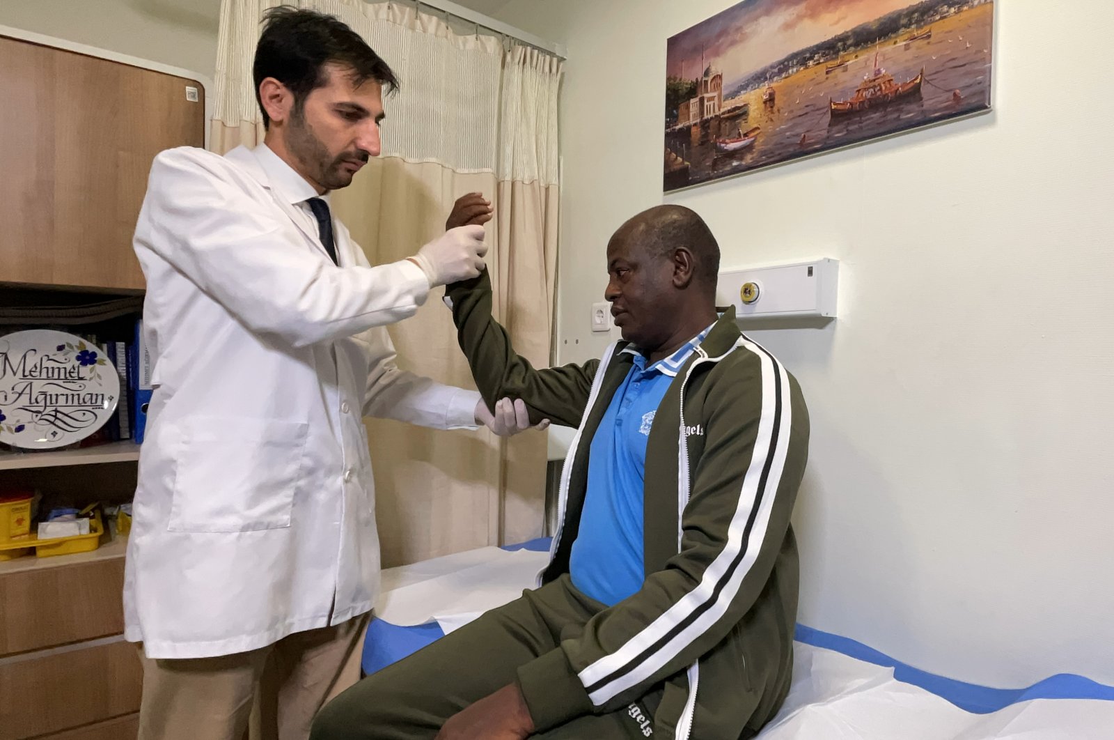 A doctor examines Ousman Tabit Abdoulaye, in Istanbul, Türkiye, Dec. 5, 2022. (AA Photo) 