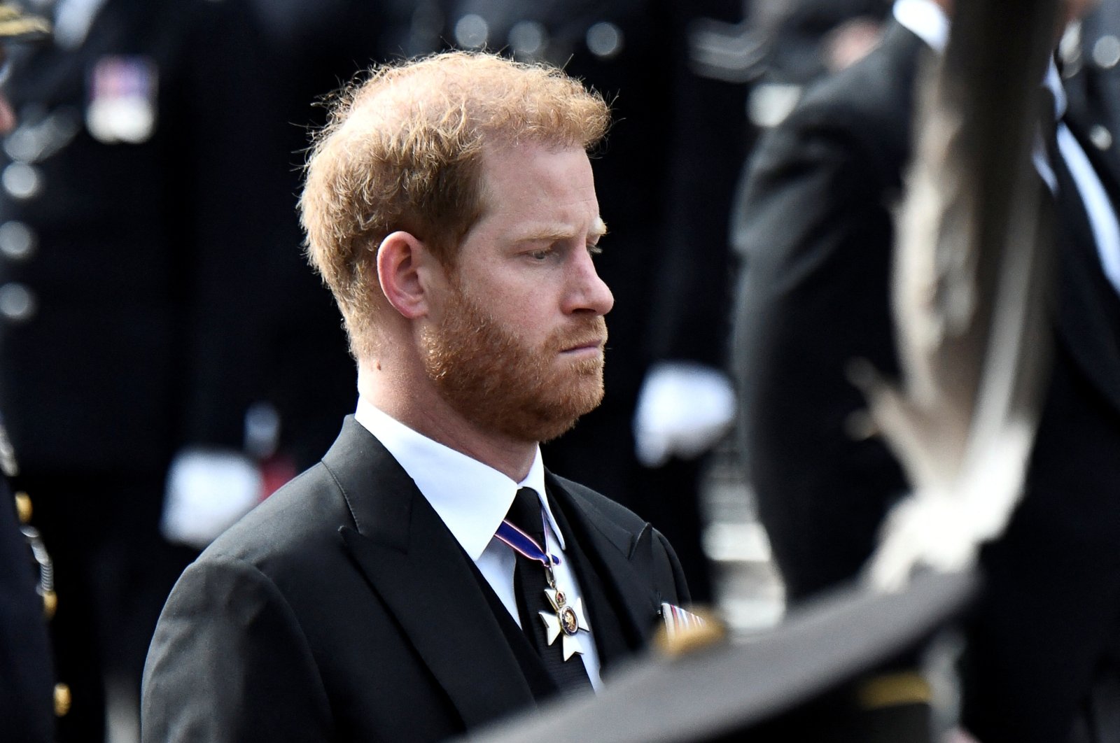 Britain&#039;s Prince Harry follows the coffin of Queen Elizabeth II during her funeral procession from Westminster Abbey to Wellington Arch in London, U.K., Sept. 19, 2022. (Reuters Photo)
