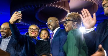 U.S. Democratic Sen. Raphael Warnock (C) celebrates after his reelection to the Senate, Atlanta, Georgia, U.S., Dec. 6, 2022. (EPA Photo)