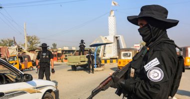 A member of the Taliban security forces stands guard at a checkpoint along a street in Jalalabad, Afghanistan, Dec. 6, 2022. (Photo by AFP)