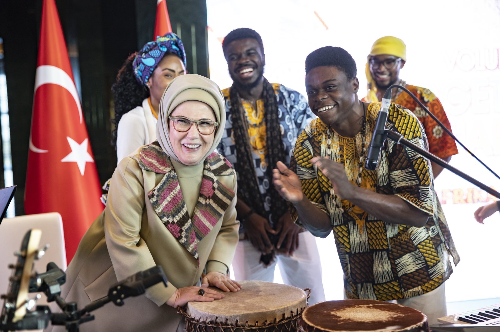 First lady Emine Erdoğan, tries a rhythm on the request of African students at the Africa House program held at the Presidential Complex, Ankara, Türkiye, Dec. 6, 2022. (AA Photo)
