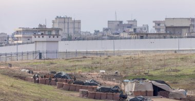 Turkish army vehicles are positioned at a military post as the Syrian border town of Jarablus is seen behind the Turkish-Syrian border line in Karkamış in Gaziantep province, Türkiye, Nov. 29, 2022. (Reuters Photo)