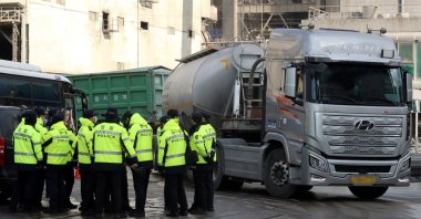 Police officers are deployed at a cement factory as unionized truckers go on a strike in Danyang, South Korea, Dec. 7, 2022. (Reuters Photo)