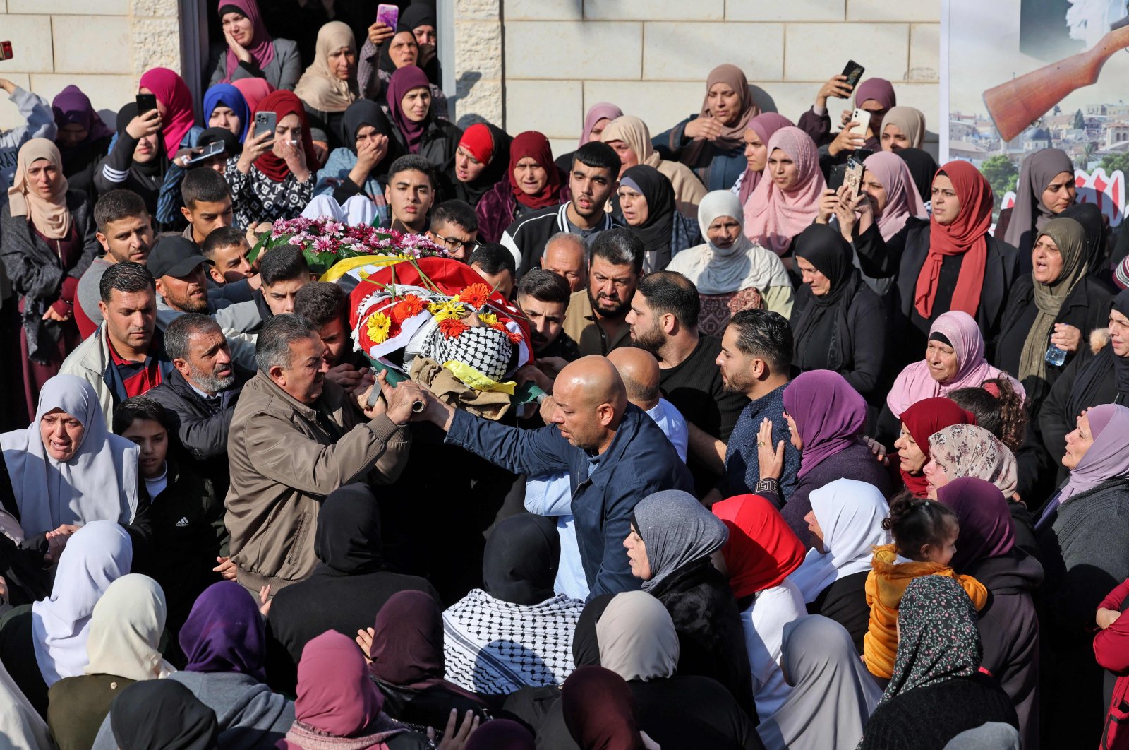 Palestinian mourners attend a funeral procession in the village of Silwad, in the Israeli-occupied West Bank, Palestine, Dec. 8, 2022. (AFP Photo)