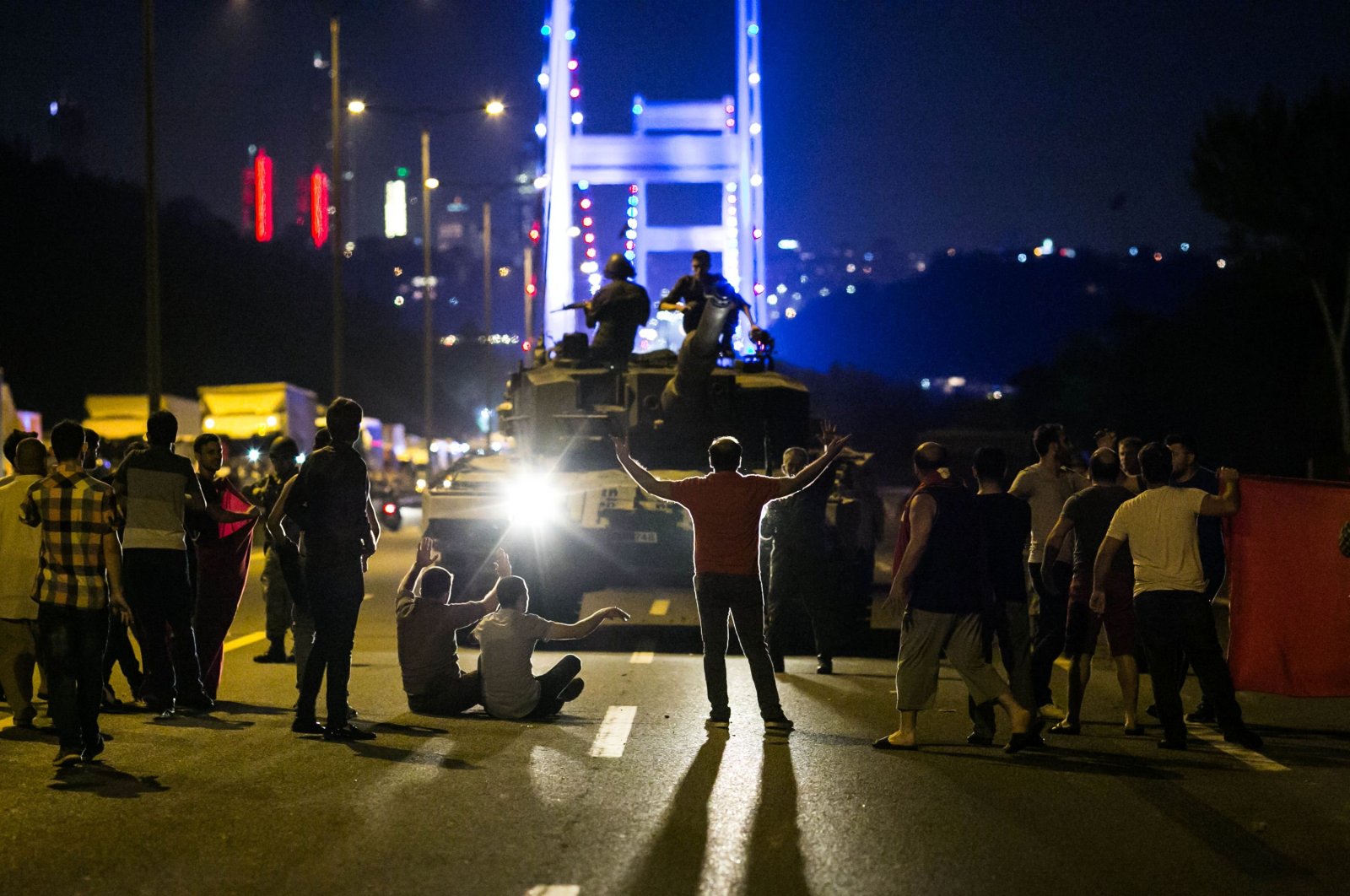People take over a tank commanded by putschists near Fatih Sultan Mehmet Bridge, in Istanbul, Türkiye, July 16, 2016. (AFP Photo)