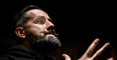 Russian right-wing blogger, political scientist, writer Roman Antonovsky gestures as he talks during an interview in Moscow, Russia, Nov. 30, 2022. (AFP Photo)