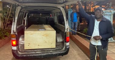The wooden coffin containing the body of Pakistani journalist Arshad Sharif, who was shot dead when police hunting car thieves opened fire on the vehicle he was traveling in as it drove through their roadblock without stopping, is loaded into a courtesy van at the Chiromo mortuary in Nairobi, Kenya, Oct. 24, 2022. (Reuters File Photo)